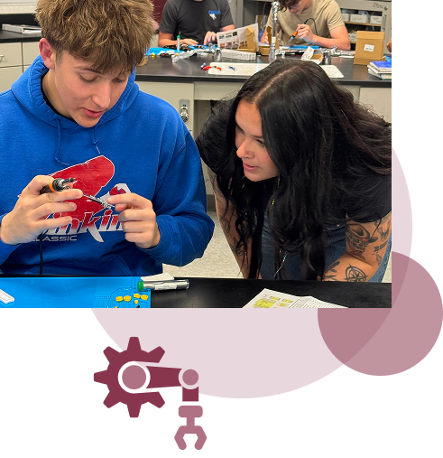 image of two students working on a project.